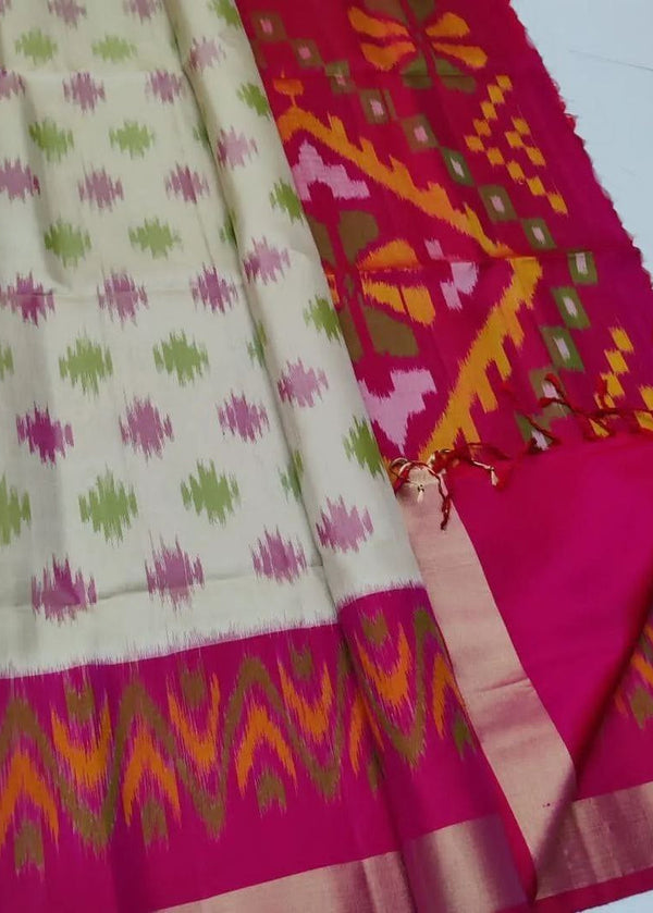 Saree with pink and green patterns on a white background