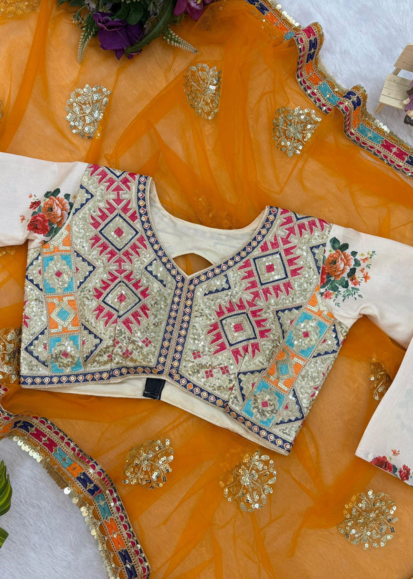 Traditional embroidered blouse on a decorative orange fabric background