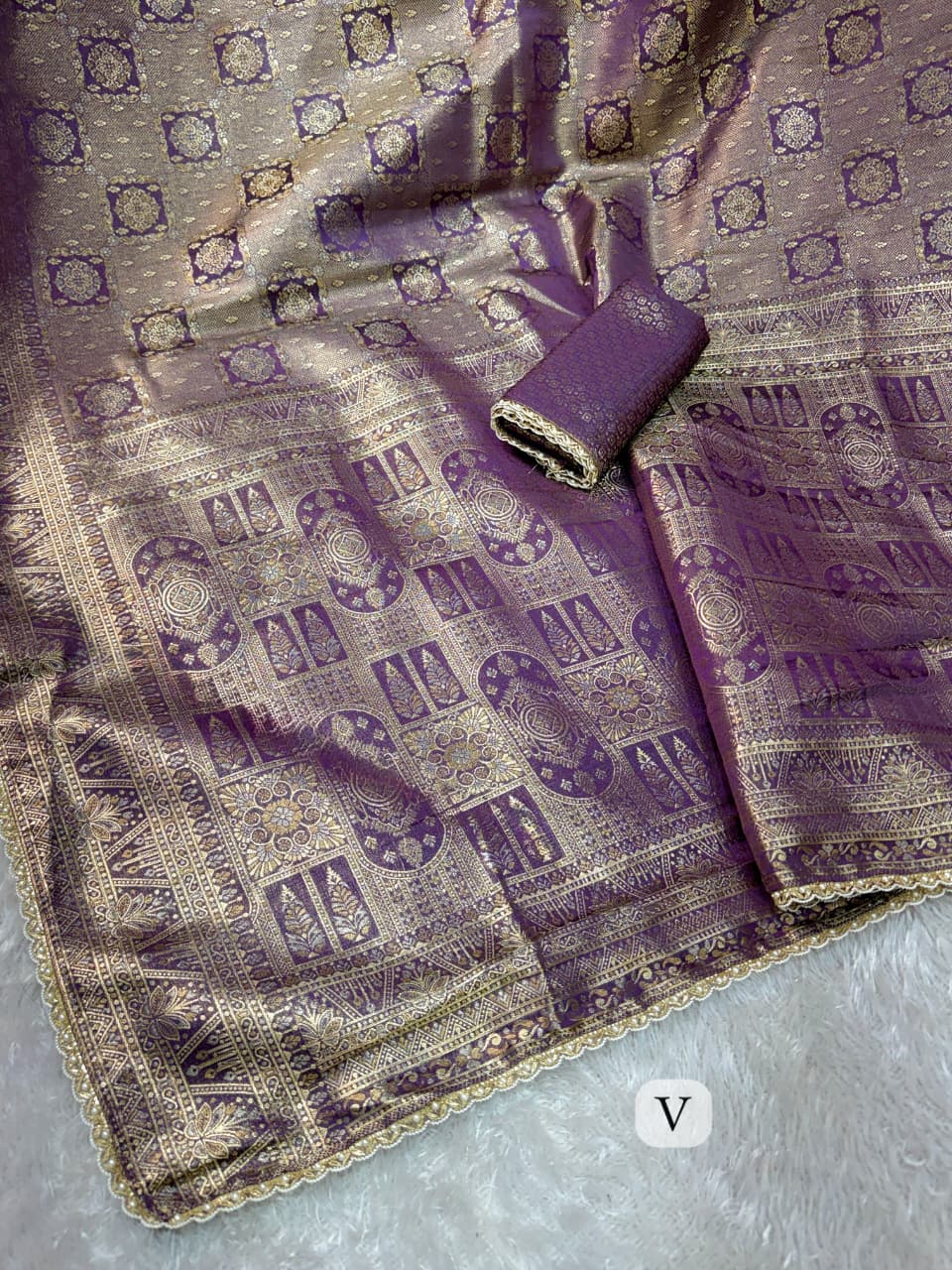 Swara purple satin jacquard silk saree worn with pearl lace border detail