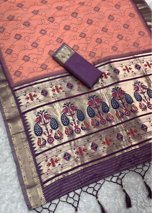 Traditional saree with intricate patterns on a textured surface