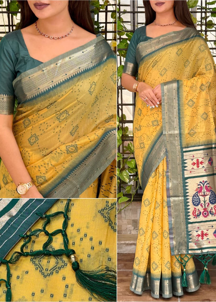 Yellow saree with green and white patterns, displayed against a natural background.