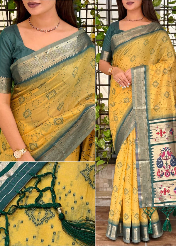 Yellow saree with green and white patterns, displayed against a natural background.