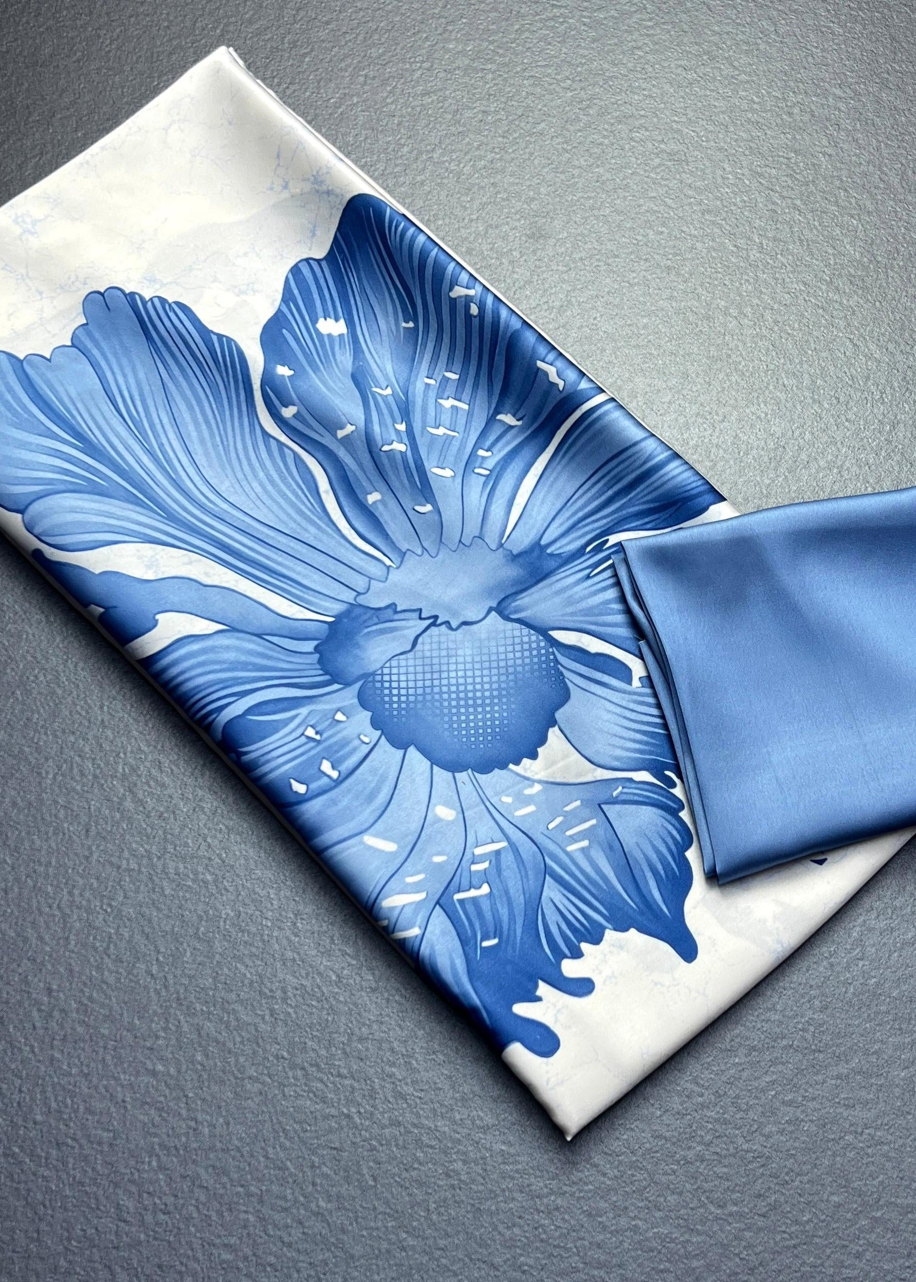 Blue floral-patterned fabric on a white background