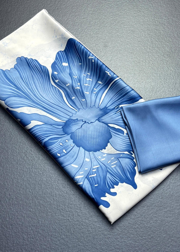 Blue floral-patterned fabric on a white background