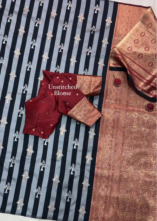 Unstitched blouse with intricate patterns on a striped fabric background