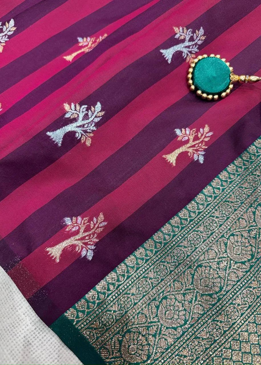 Saree with purple and pink stripes and tree patterns, green border