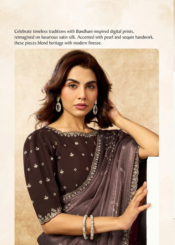 Woman wearing a saree with a neutral background