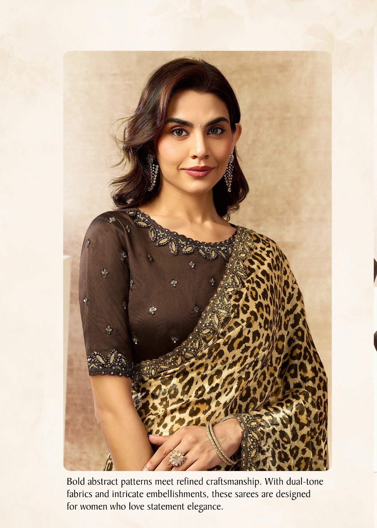 Woman wearing a leopard print saree with a plain background