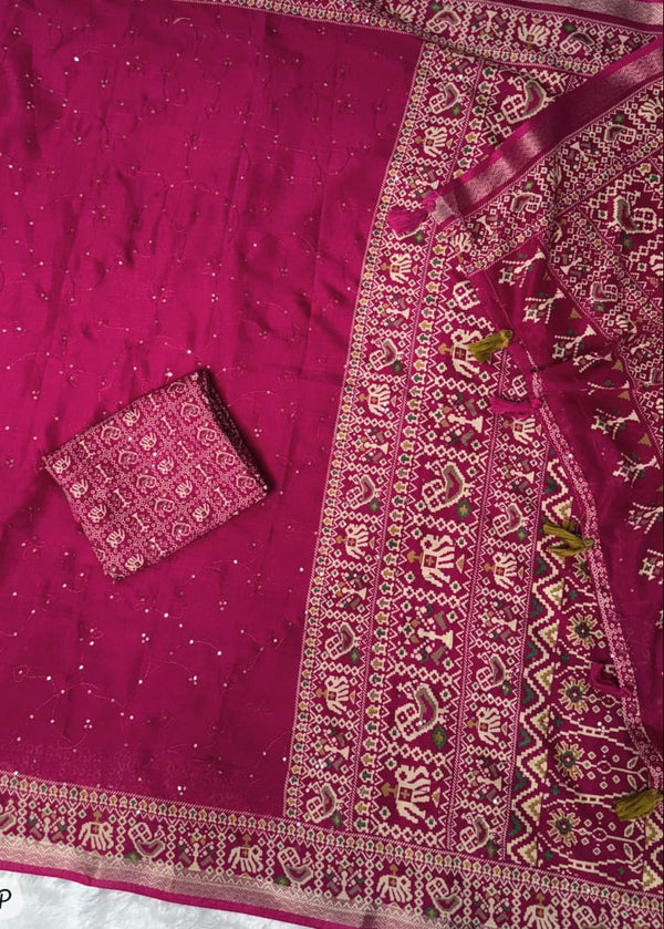 Pink saree with intricate patterns on a white background