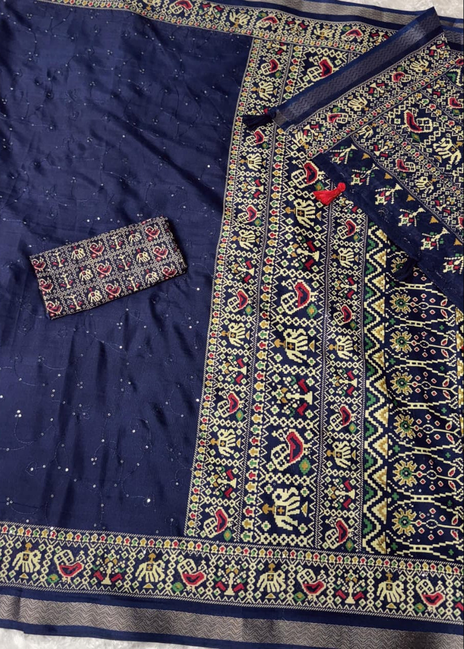 Navy blue fabric with intricate multicolored patterns