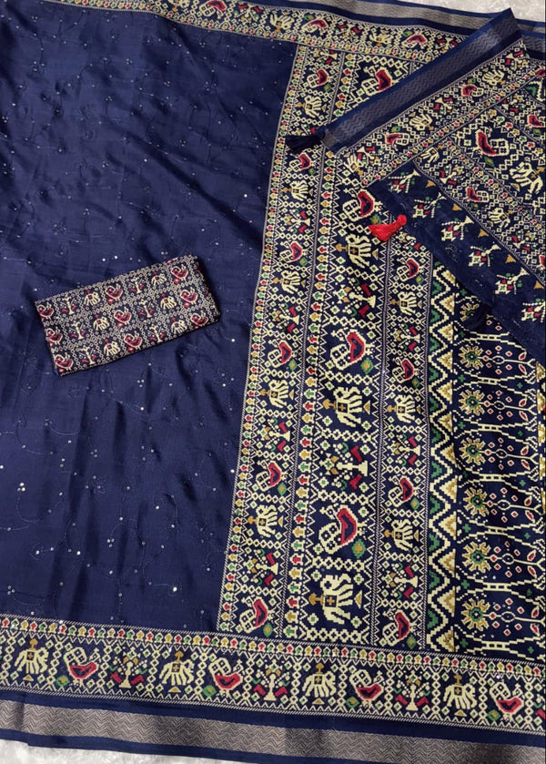 Navy blue fabric with intricate multicolored patterns