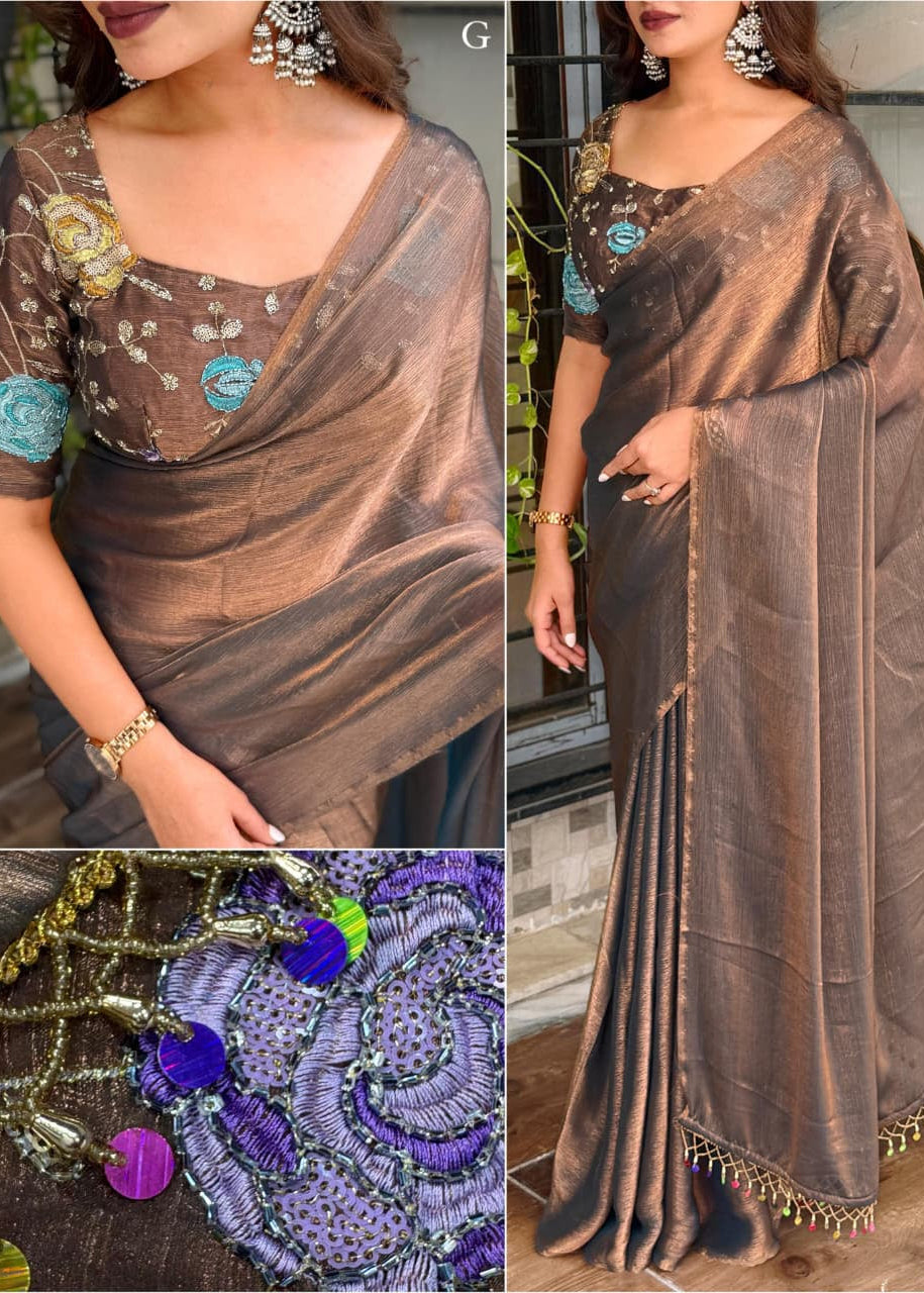 Woman wearing a brown saree with intricate designs, close-up of jewelry, and full-length view.