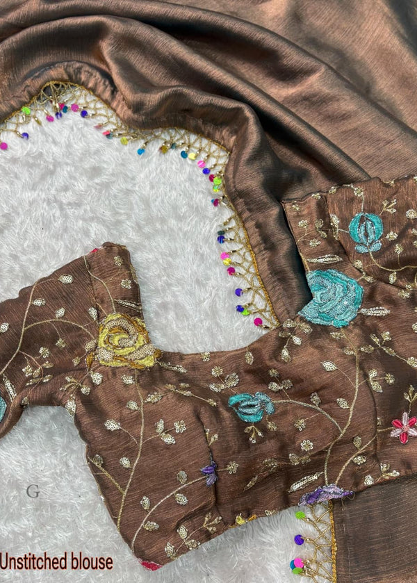 Brown un Stitched blouse with floral embroidery on a white background