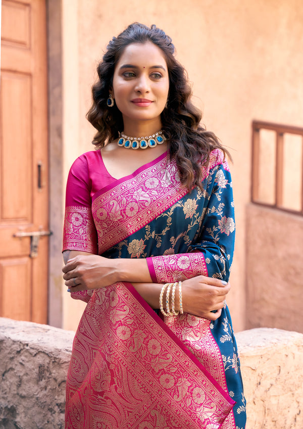Woman wearing a traditional saree with a pink blouse in an outdoor setting