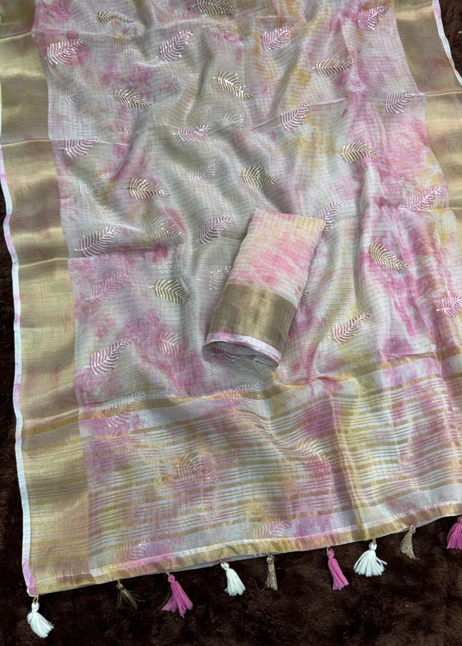 Saree with pink and gold patterns on a dark background