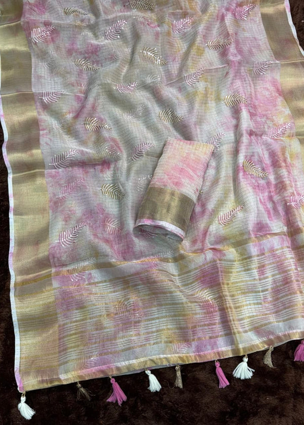 Saree with pink and gold patterns on a dark background