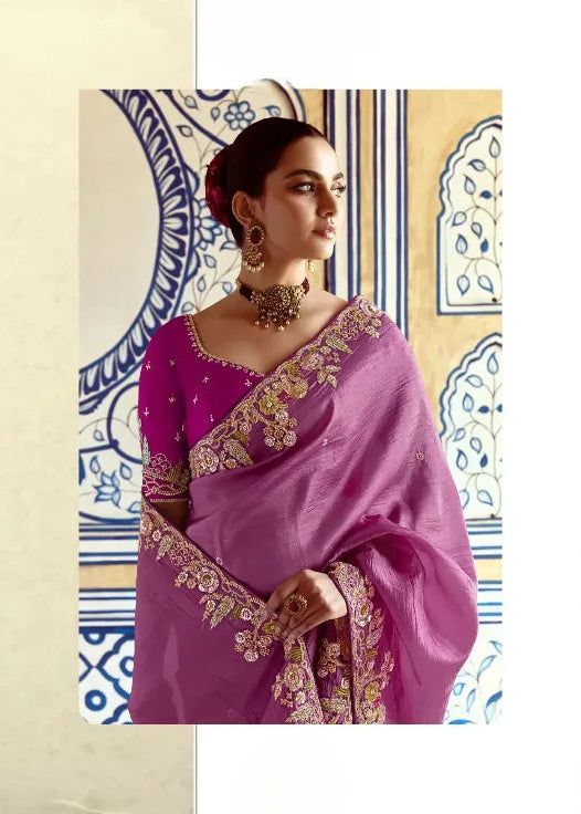 Woman wearing a purple embroidered saree with a decorative background