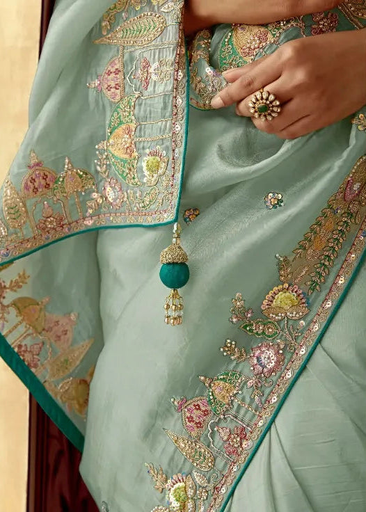 Traditional saree with intricate patterns and a close-up of a person wearing it.