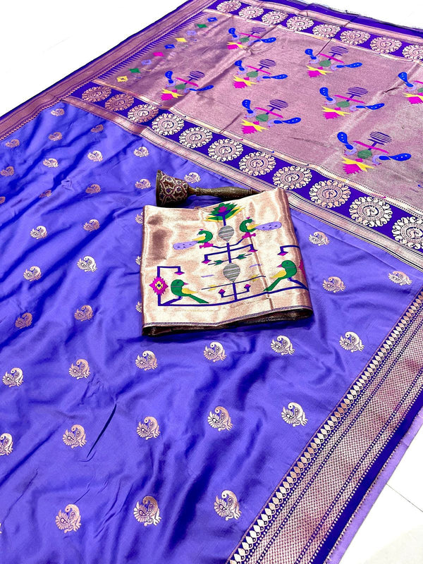 Blue saree with intricate patterns on a white background