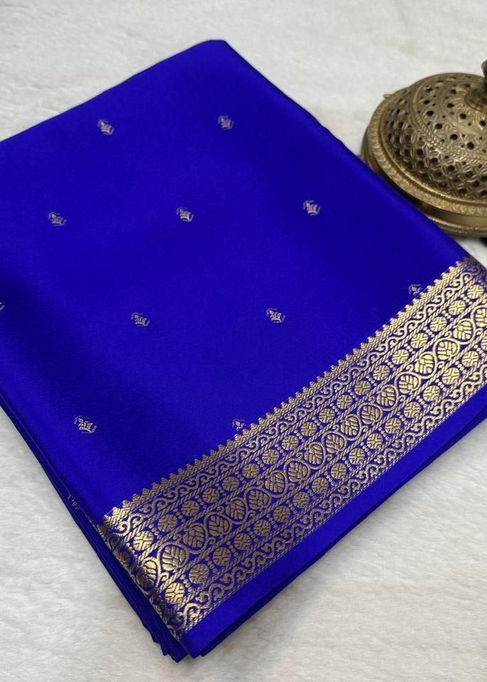 Blue saree with gold border on a white background