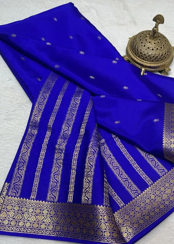 Blue saree with gold patterns on a white background