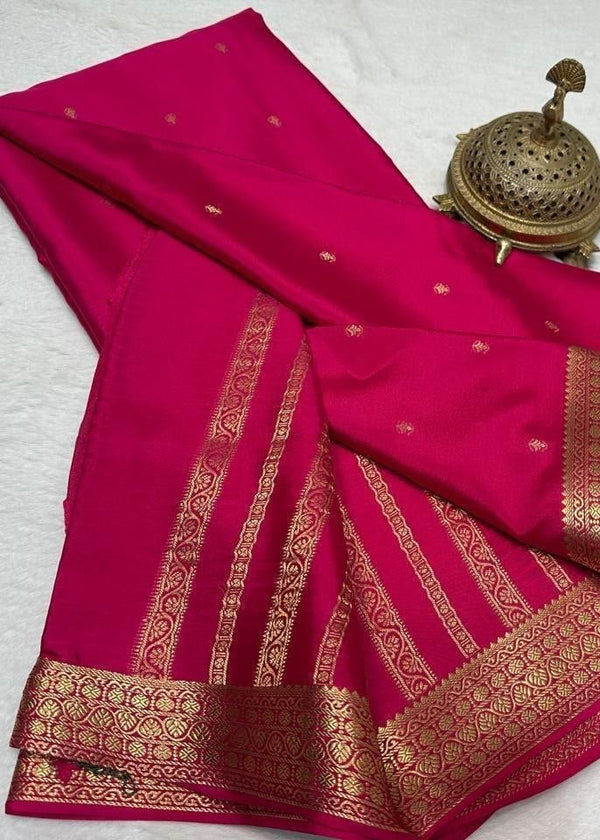 Pink saree with gold border on a white background