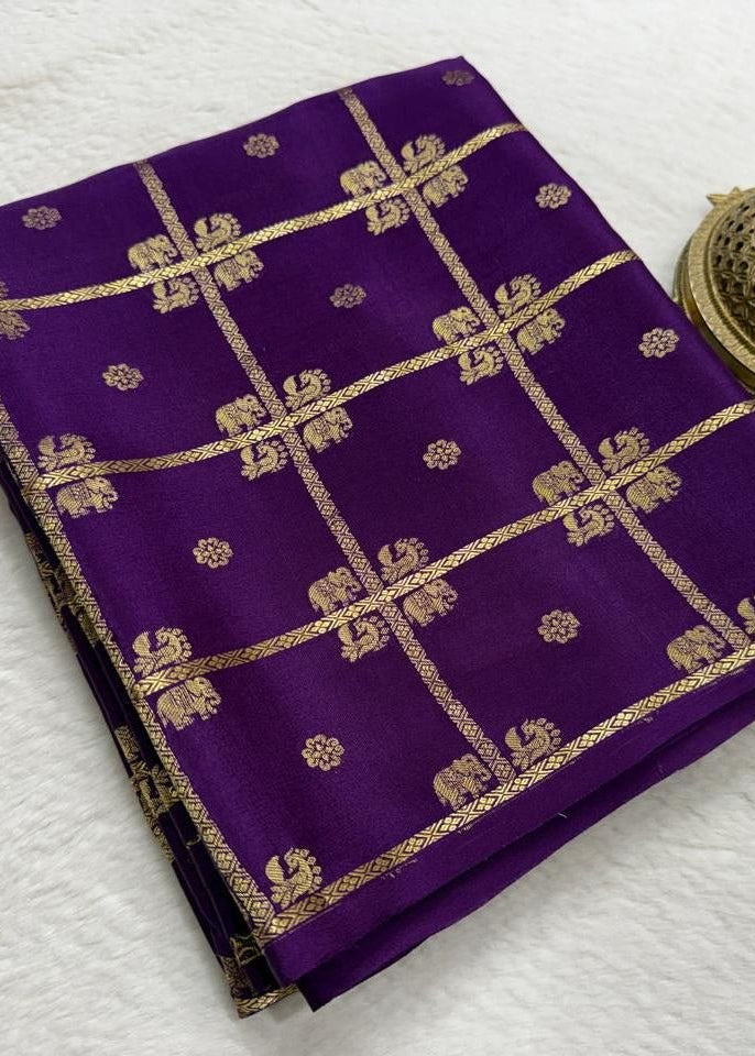 Purple fabric with gold patterns on a white background