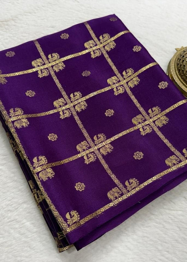 Purple fabric with gold patterns on a white background