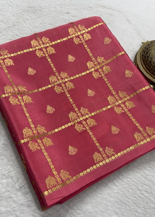 Red fabric with gold patterns and a brass incense holder on a white background