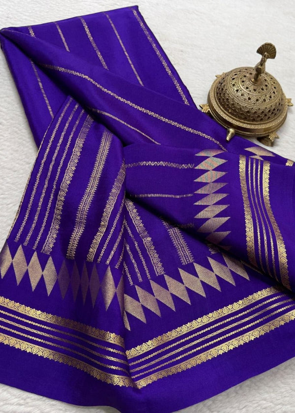 Purple fabric with gold patterns on a white background