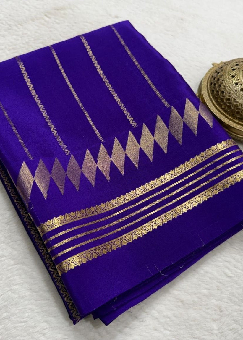 Purple saree with gold patterns on a white background