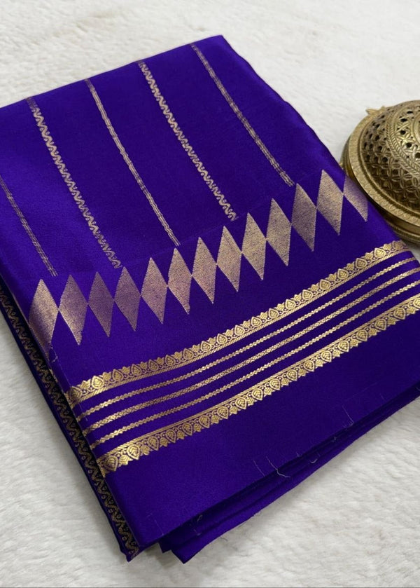 Purple saree with gold patterns on a white background
